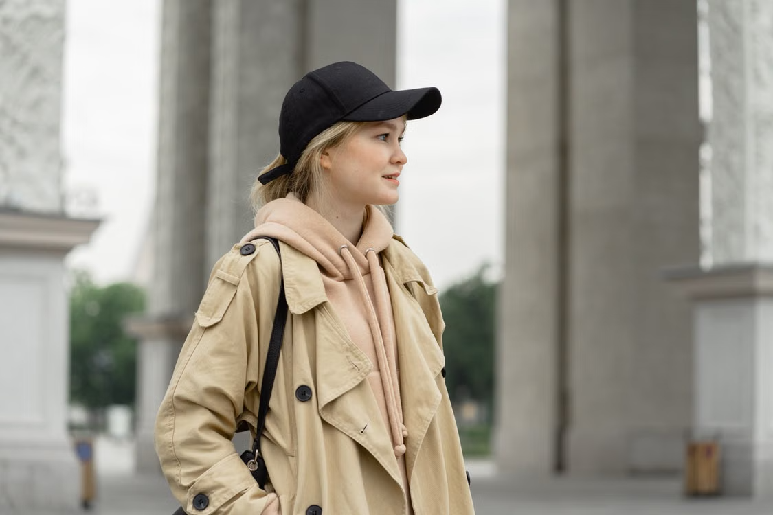 Man wearing a cap with a matching tracksuit, showing caps outfit ideas for 2026