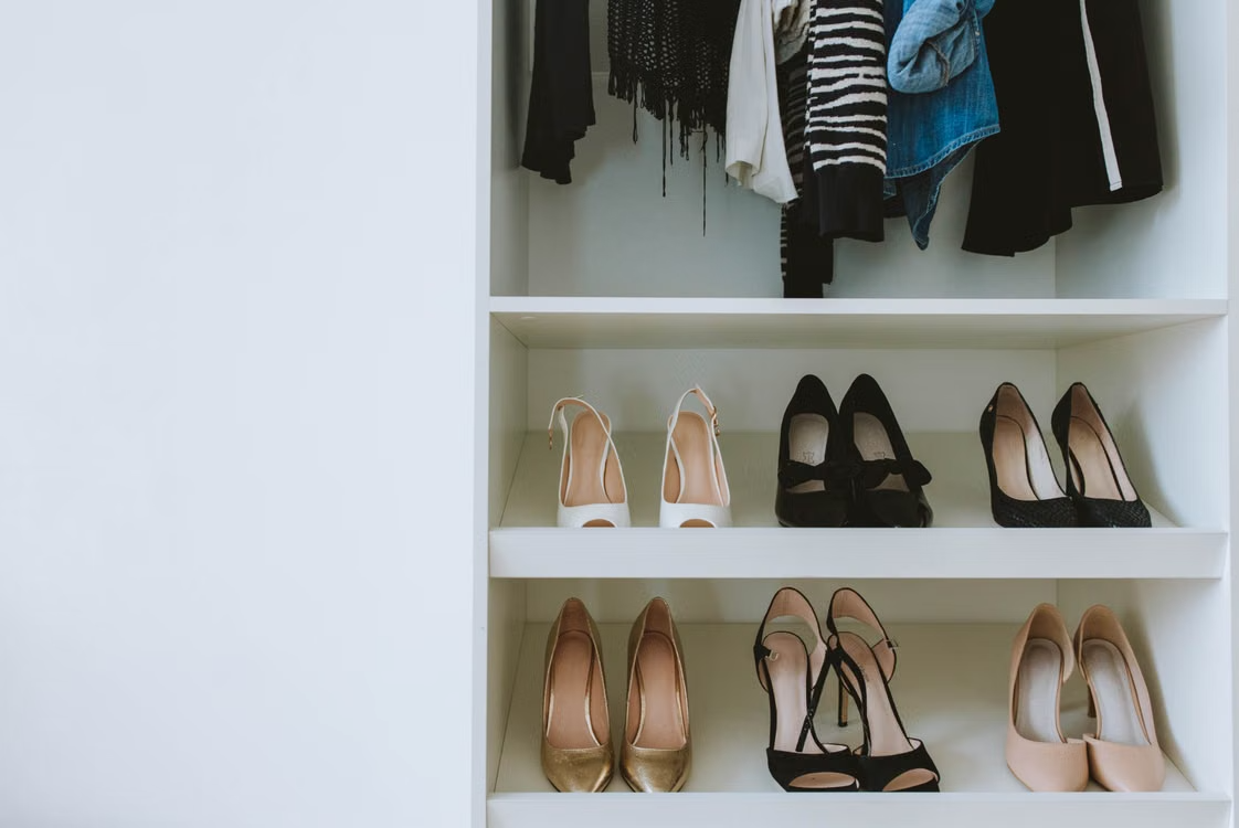 Minimalist white leather sneakers styled as capsule wardrobe shoes